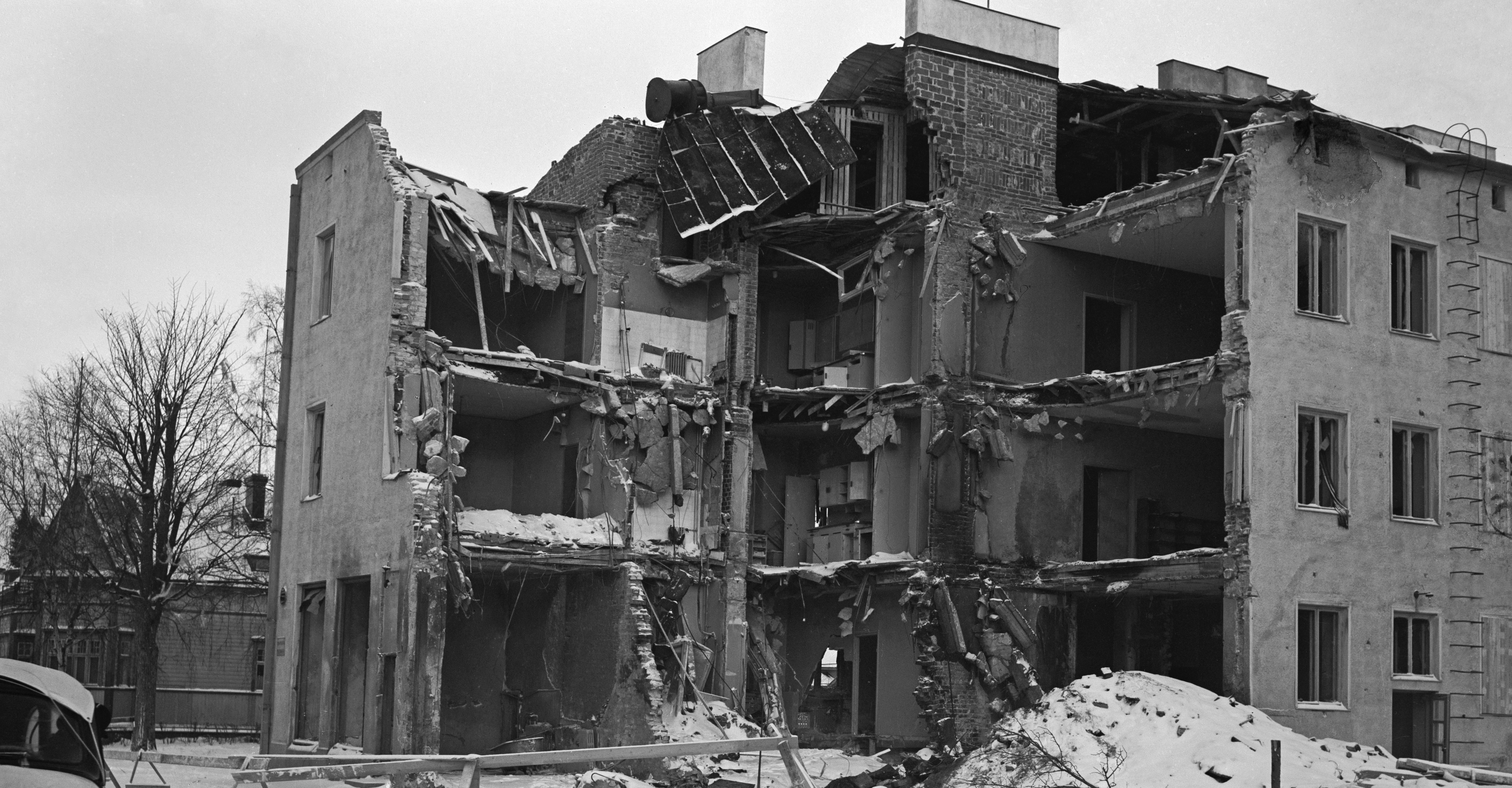 A photograph of bombed-out, collapsed buildings.