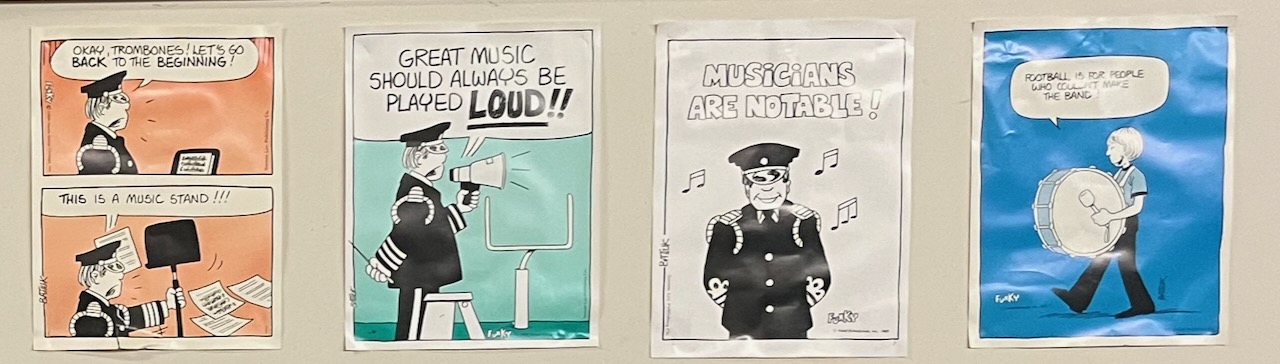 A cose up of four posters: 'Okay trombones! Let's go back to the beginning! This is a music stand!!', 'Great music should always be played LOUD!!', 'Musicians are notable!', 'Football is for people who couldn't make the band!'