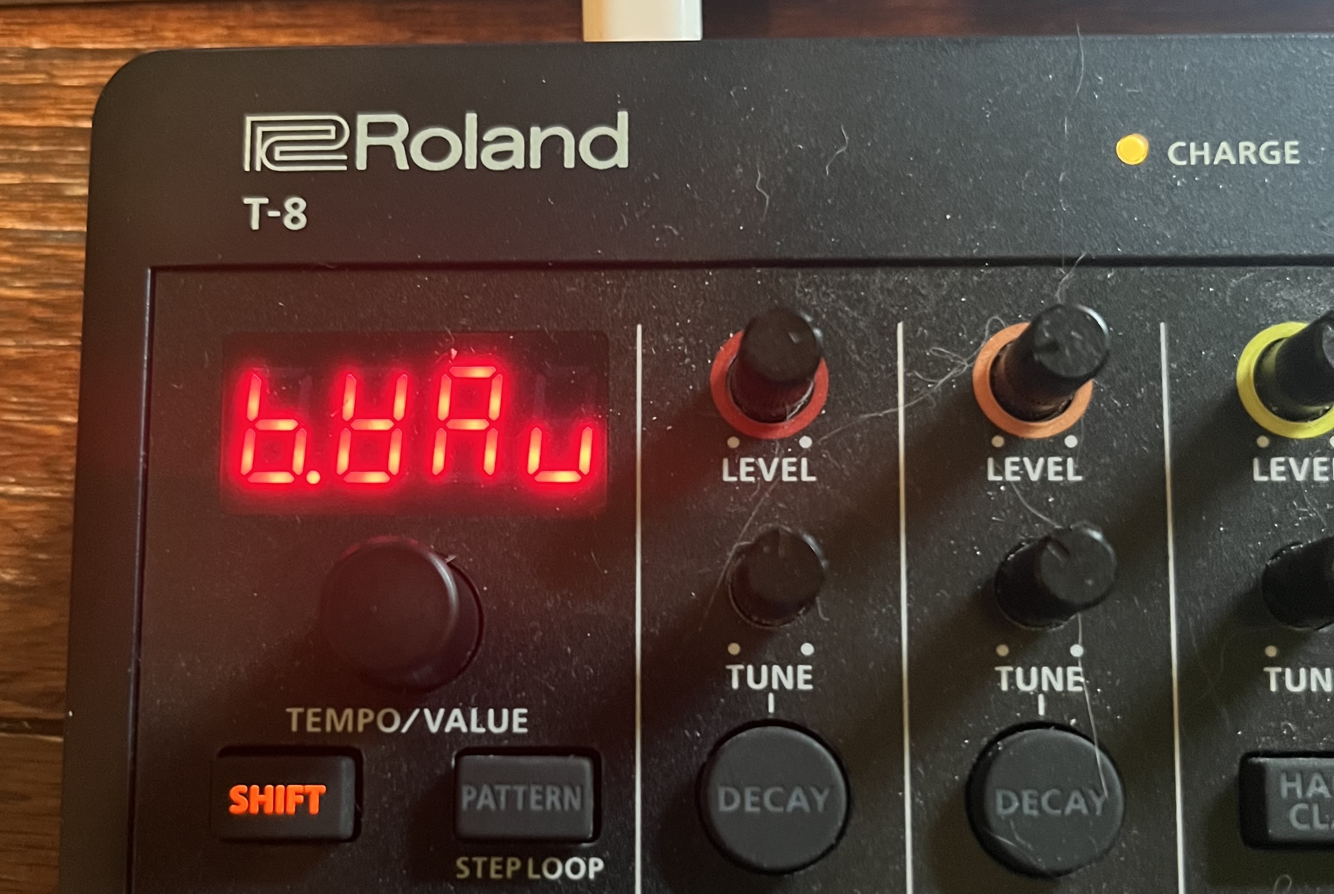 The four-character, glowing-red display of a Roland T-8. It says 'b.Wav', except that the W looks like an upside-down capital A, and the V is more like a lowercase U.
